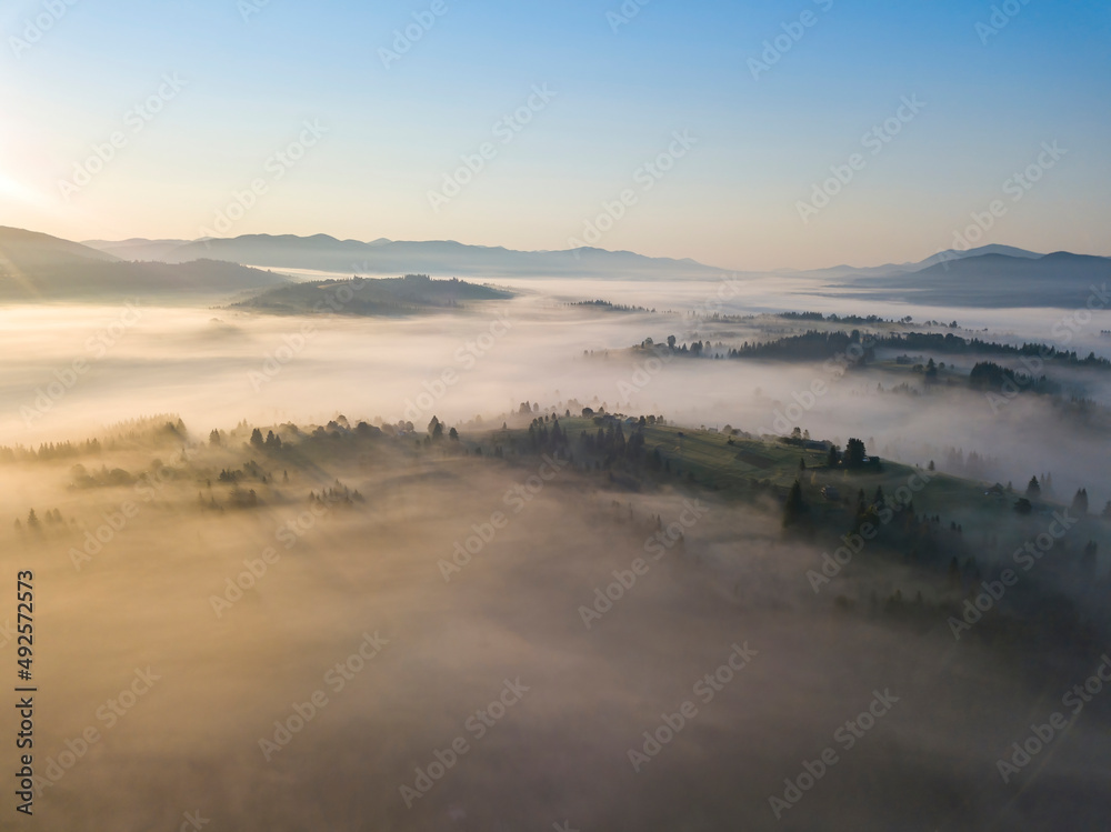 Morning fog in the Ukrainian Carpathians. Aerial drone view.