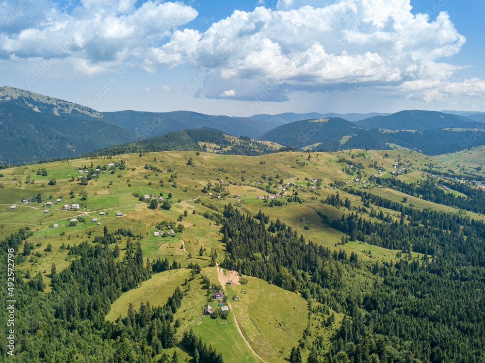 Green mountains of Ukrainian Carpathians in summer. Sunny day. Aerial drone view. Green mountains of Ukrainian Carpathians in summer. Sunny day. Aerial drone view.