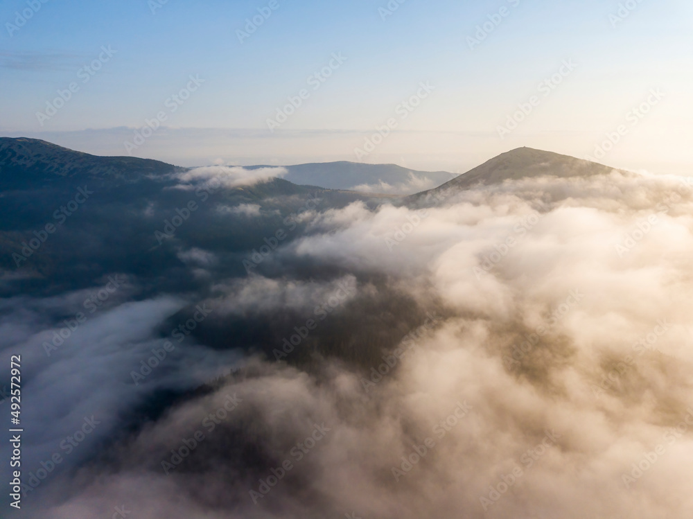 Obraz premium Morning fog in the Ukrainian Carpathians. Aerial drone view.