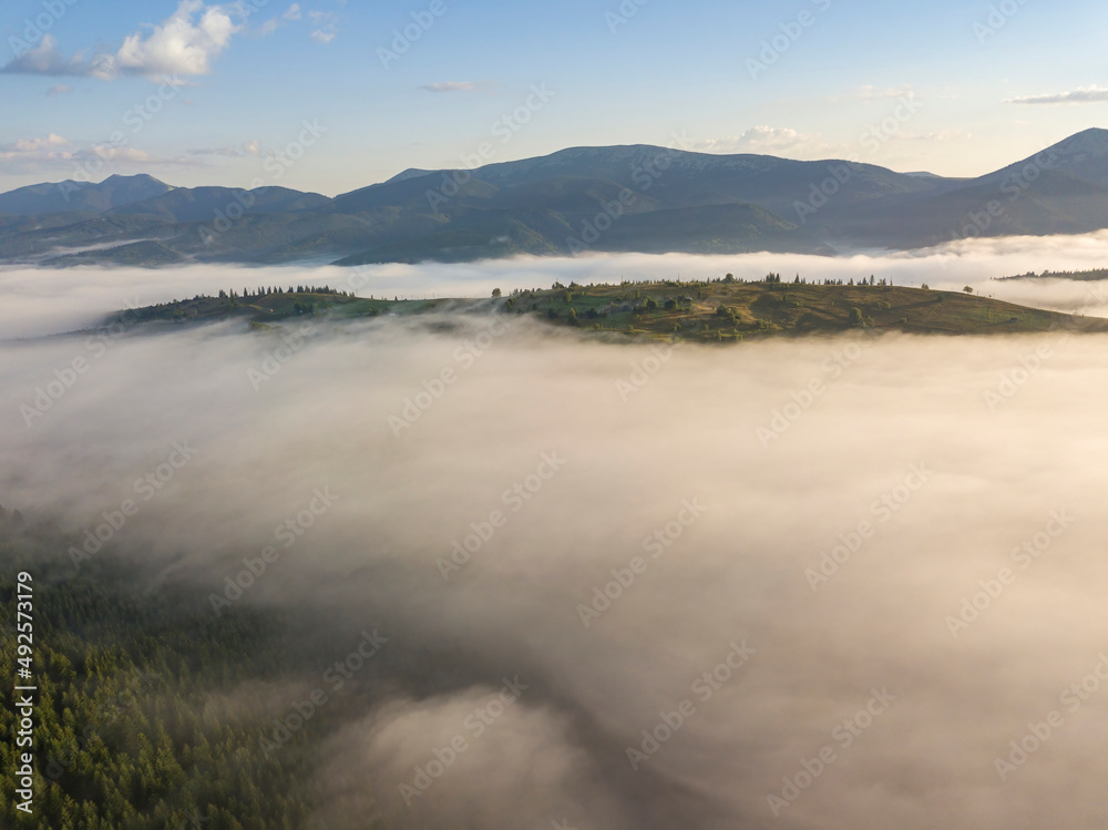 Fototapeta premium Morning fog in the Ukrainian Carpathians. Aerial drone view.