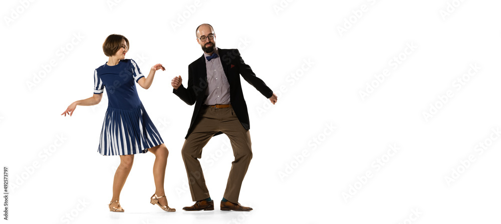 Flyer. Couple of dancers, young man and woman in vintage retro style  outfits dancing swing dance isolated on white background. Timeless  traditions, 60s, 70s fashion style. Stock Photo | Adobe Stock