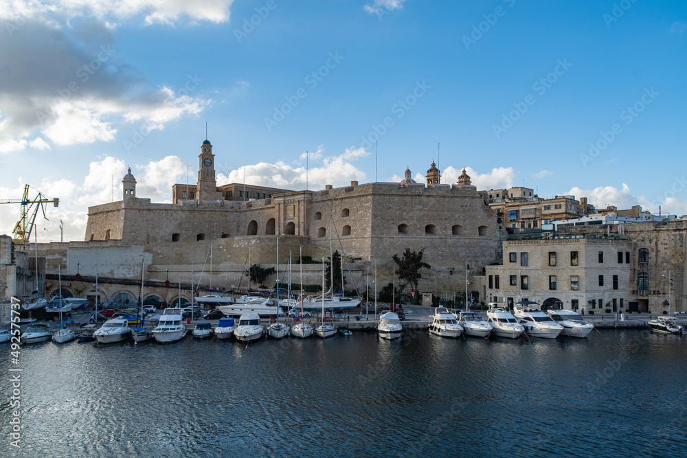 Protecting the entrance to the fortified city of Senglea in Malta, is the Saint Michael Bastion. At its base are sailing boats and yachts moored in Dockyard Creek.