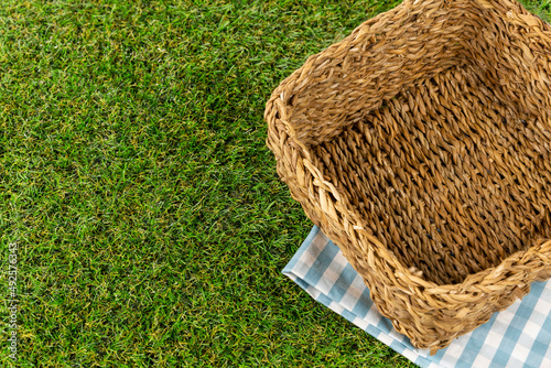 wicker basket on green ground