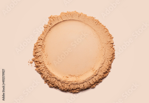 Bronzer or blusher and compact powder beige brown nude smudge white isolated background photo