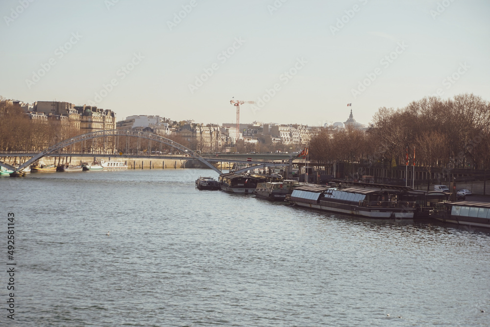 Morning traffic on the streets of Paris next to Seine River. France, 2022. photo during the day.