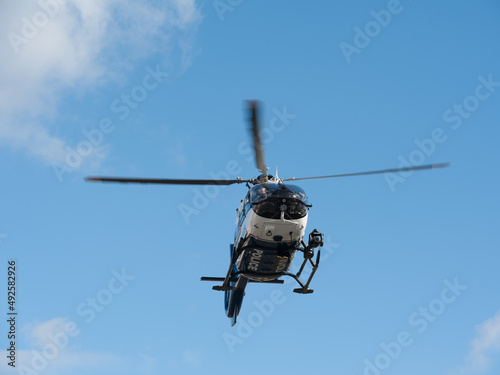 Wallpaper Mural Lviv, Ukraine - 02.18.2022: Police helicopter during flight on the sky background Torontodigital.ca