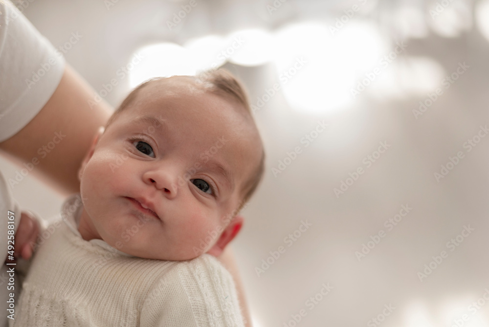 an unrecognizable woman holding a newborn baby an unrecognizable woman holding a newborn baby