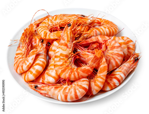 Shrimps on a plate isolated on white background. Seafood concept. Red cooked prawn Top view