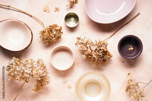 Table setting with hortesia dried flowers. Pastel  natural colors. Top view.