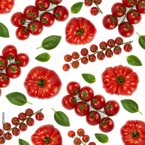 Fototapeta Naklejka Na Ścianę i Meble -  Cherry tomatoes and basil leaves pattern on white background. Flat lay.