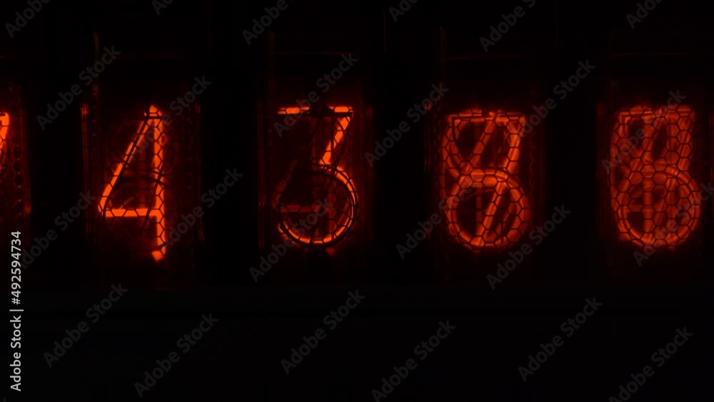 Retro vacuum tube display on the device counts seconds. Displaying