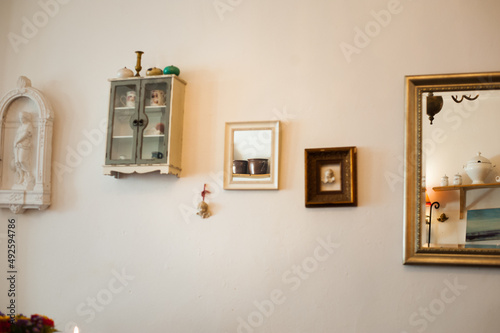 interior decorated with vintage frames and mirrors