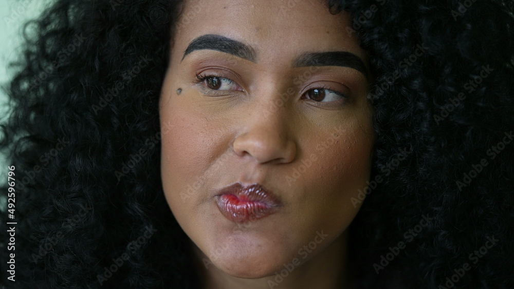 A doubtful black woman face closeup a thoughtful African person A doubtful black woman face closeup a thoughtful African person
