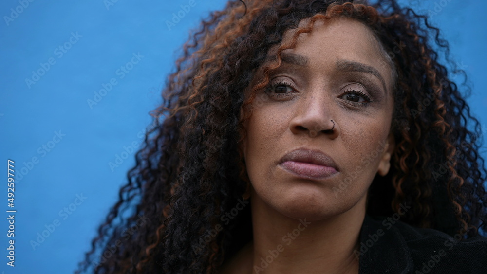 Portrait of an African black woman posing for camera with serious expression