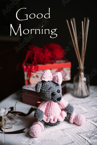 Stuffed toys on the table with the text of the greeting "Good morning"