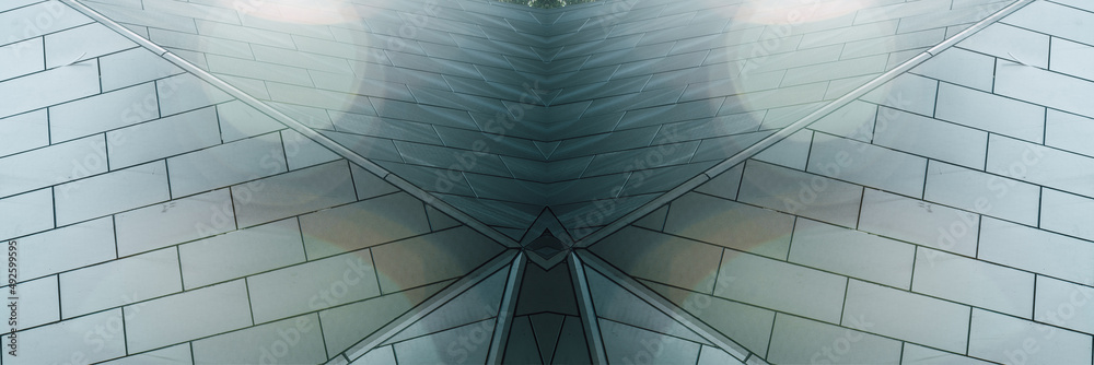Obraz premium underside panoramic and perspective view to steel blue glass high rise building skyscrapers, business concept of successful industrial architecture