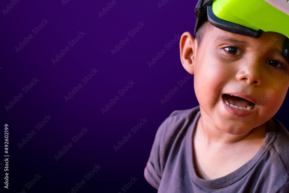 Latin boy experiencing the metaverse using virtual reality goggles Latin boy experiencing the metaverse using virtual reality goggles