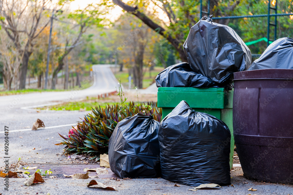 pile of garbage plastic black and trash bag waste many on the road pile of garbage plastic black and trash bag waste many on the road