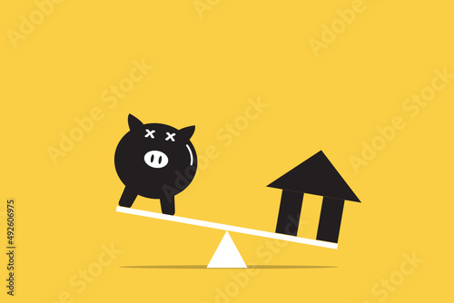 Home loans market. Model house and piggy bank balancing on a seesaw