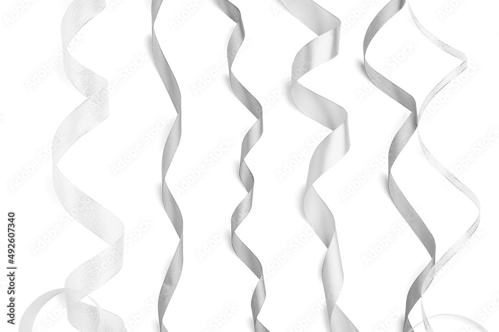 Curly silver ribbons on white background Curly silver ribbons on white background