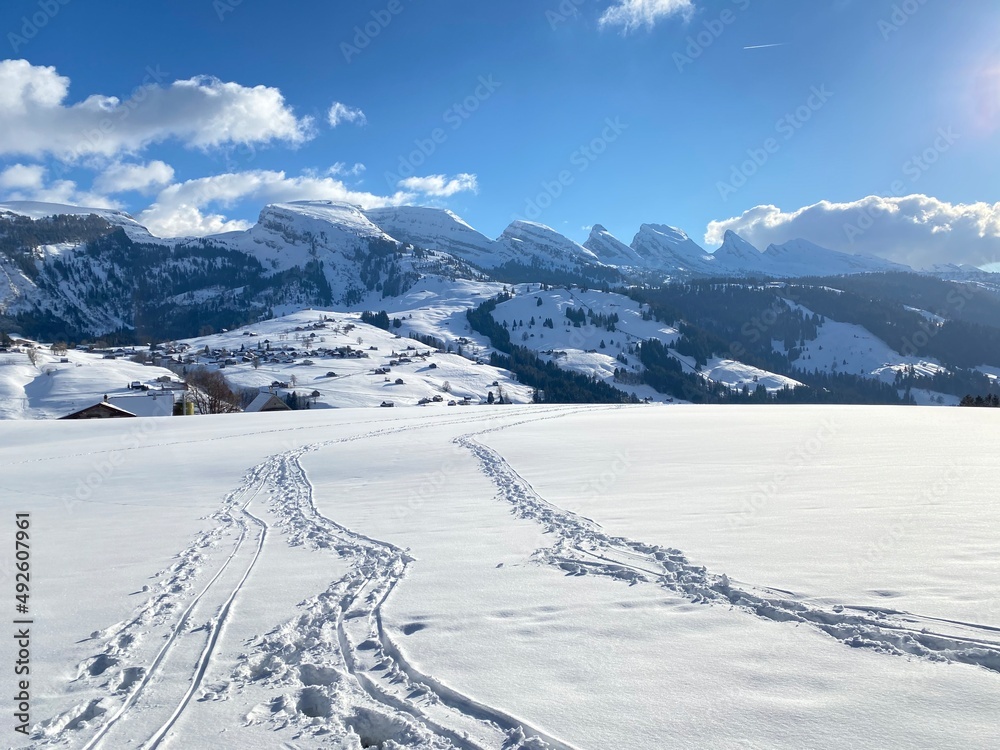 Wonderful winter hiking trails and traces on the slopes of the Alpstein mountain range and in the fresh alpine snow cover of the Swiss Alps - Unterwasser, Switzerland (Schweiz)