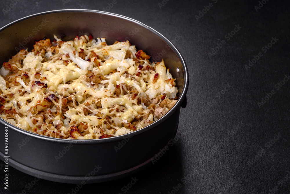 Tasty healthy dish of cauliflower and beef mince baked with lactose-free cheese Tasty healthy dish of cauliflower and beef mince baked with lactose-free cheese