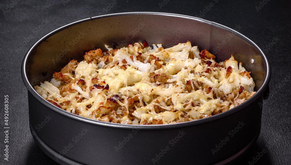 Tasty healthy dish of cauliflower and beef mince baked with lactose-free cheese Tasty healthy dish of cauliflower and beef mince baked with lactose-free cheese