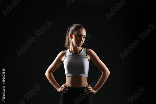 Sporty teenage girl on blac...