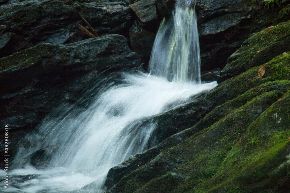 Fototapeta premium Cascading waterfall with rocks