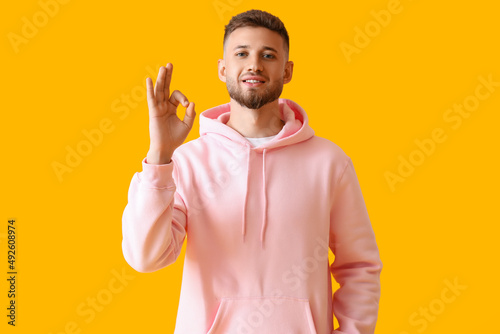 Young guy in stylish hoodie...