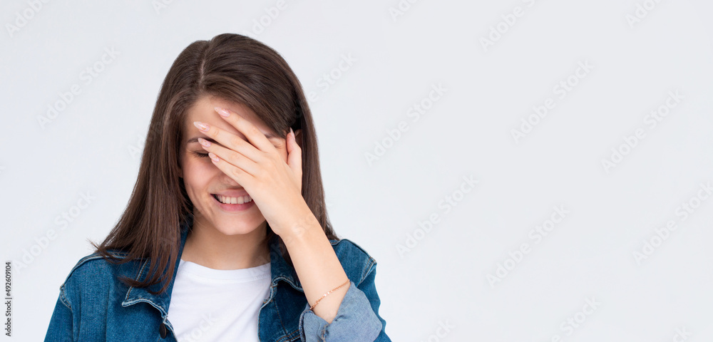 laughing woman embarrassed with her silliness covering with hand. facepalm failure and shame concept. laughing woman embarrassed with her silliness covering with hand. facepalm failure and shame concept.