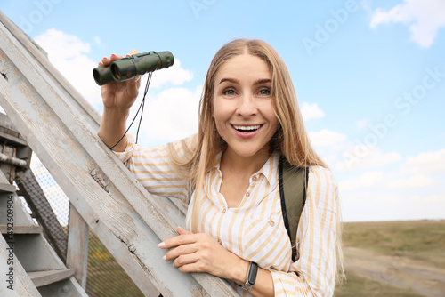 Beautiful female tourist wi...