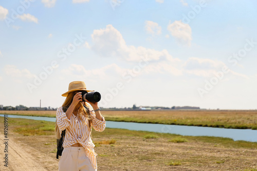 Beautiful female tourist wi...