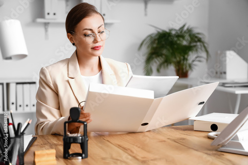 Female notary public workin...