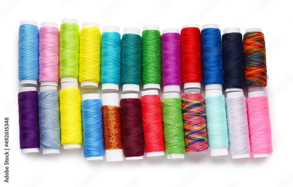 Different thread spools on white background Different thread spools on white background