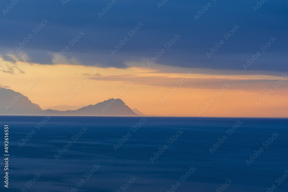 View of Cape Point Nature Reserve with a stormy sunrise over the Cape of Storms, Table Mountain National Park, South Africa. View of Cape Point Nature Reserve with a stormy sunrise over the Cape of Storms, Table Mountain National Park, South Africa.