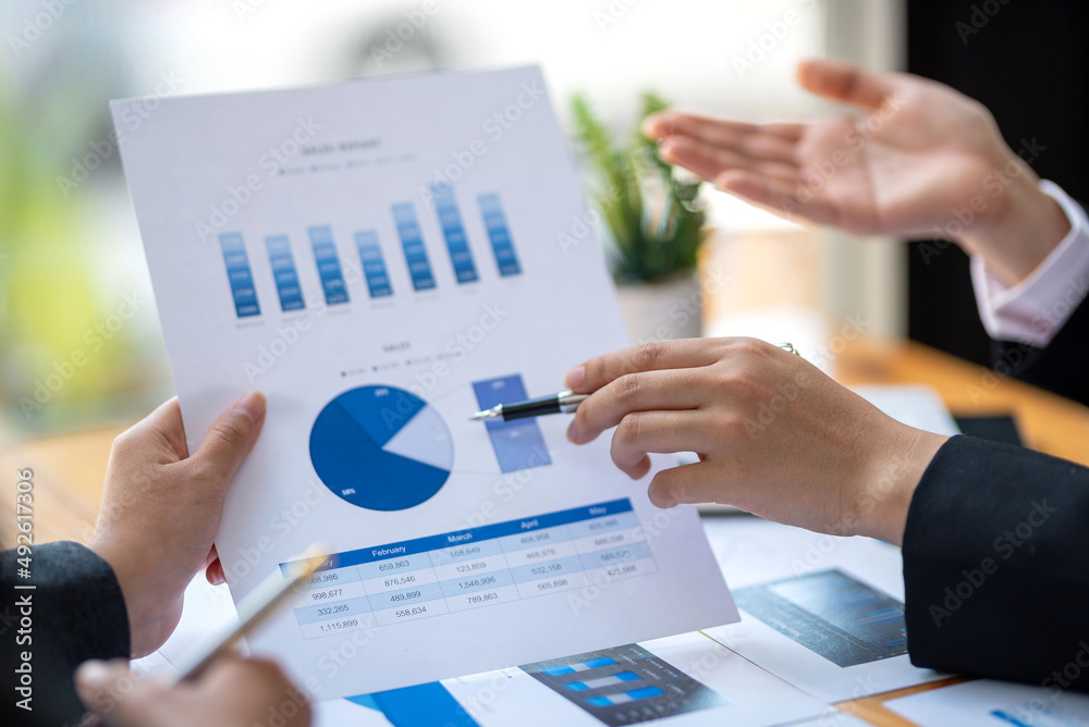 Teamwork process, business people working summary financial information at meeting. Teamwork process, business people working summary financial information at meeting.