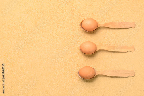 Three brown chicken eggs in...