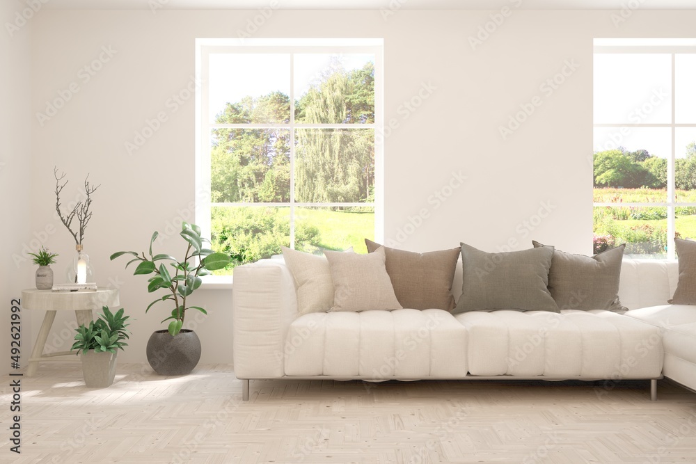 Fototapeta premium White living room with sofa and summer landscape in window. Scandinavian interior design. 3D illustration