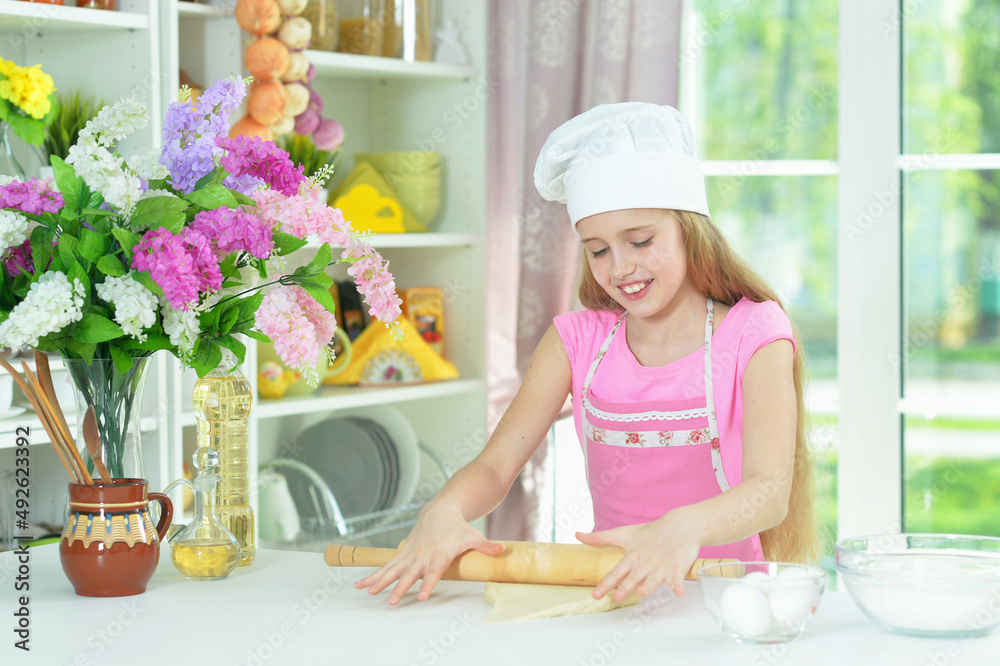 Portrait of young girl baking in the kitchen Portrait of young girl baking in the kitchen