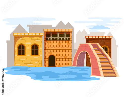 Urban medieval landscape. Stone fortress near bridge over river. Landscape of town, tourist attraction. Sight, place to visit during travel. Castle on water with towers. Pedestrian bridge over river © Dmytro
