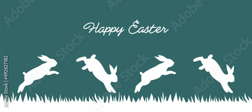 Easter greeting card. White jumping rabbits in a grass on a blue turquoise background