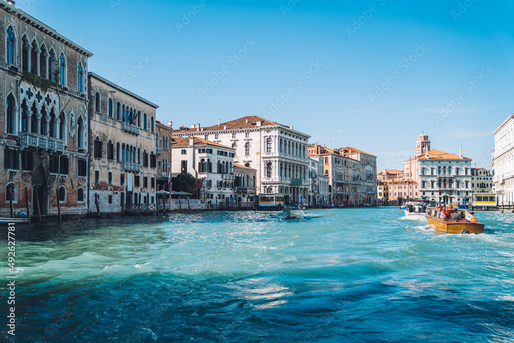 Beautiful scenery landscape of most romantic European city - Venice located on Grand Canal of Adriatic sea, ancient Italian architecture buildings for visiting by motorboat taxi