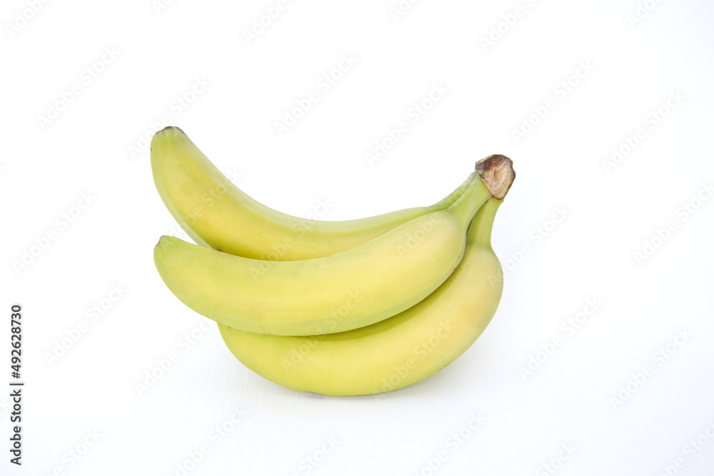 A group of bunch of bananas (Cavendish Banana) isolated on white background. fresh whole green and yellow organic banana cluster. healthy fruit with antioxidant A group of bunch of bananas (Cavendish Banana) isolated on white background. fresh whole green and yellow organic banana cluster. healthy fruit with antioxidant