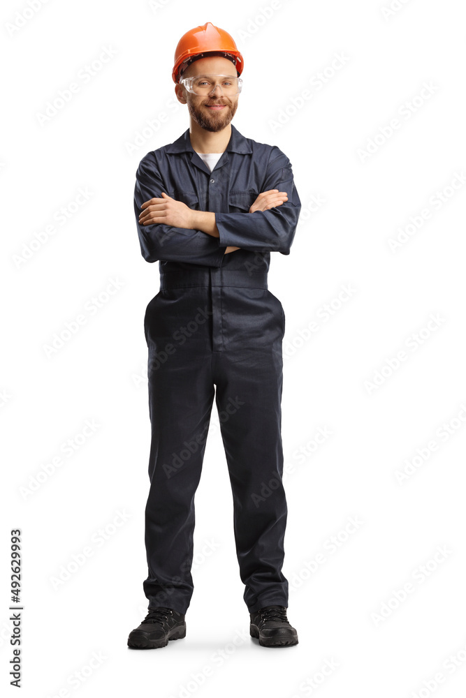 Technician in a uniform with a helmet and goggles posing Technician in a uniform with a helmet and goggles posing