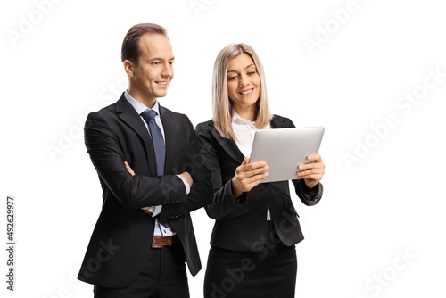 Businessman and businesswoman looking at a digital tablet