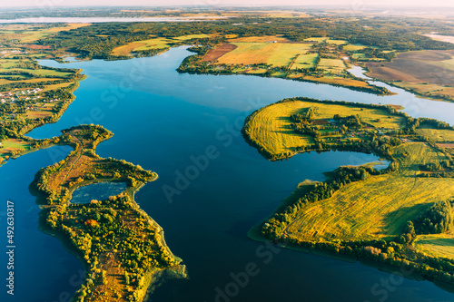 Braslaw Or Braslau, Vitebsk Voblast, Belarus. Aerial View Of Nedrava Lake, Green Forest And Meadow Landscape In Sunny Autumn Morning. Top View Of Beautiful European Nature From High Attitude. Bird's