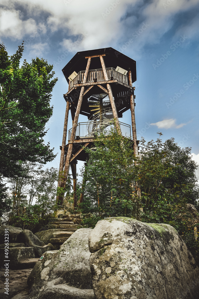 A wooden lookout tower on top of Mount Cap, a tourist attraction on the mountain hiking trail.