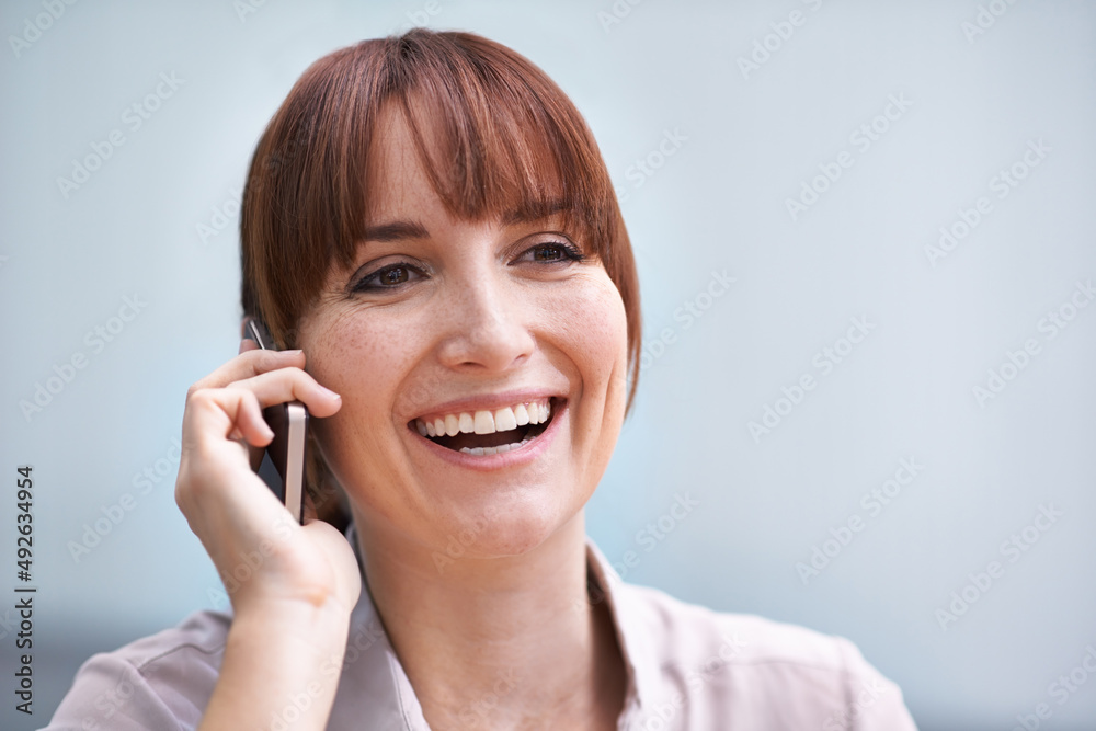 Mobile positivity. Head and shoulders shot of a young businesswoman talking on a cellphone. Mobile positivity. Head and shoulders shot of a young businesswoman talking on a cellphone.