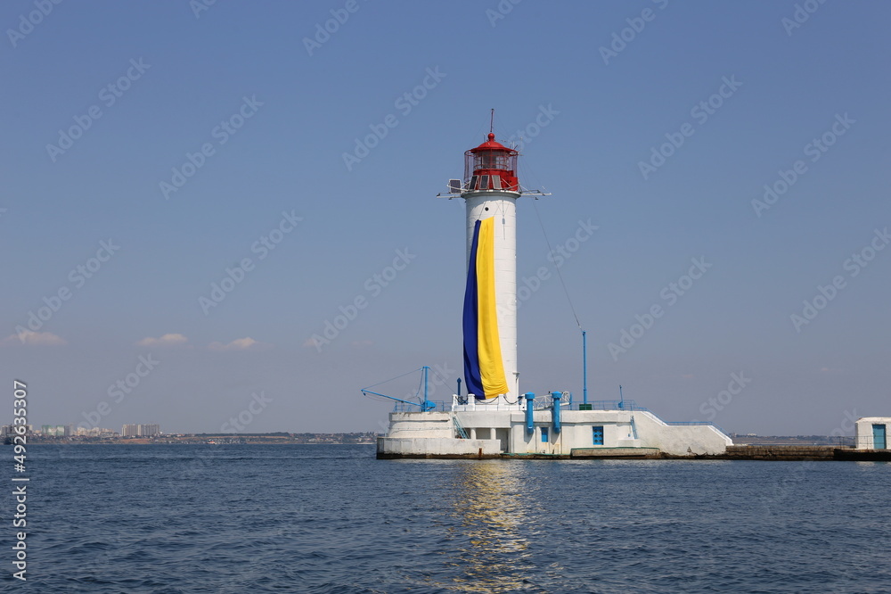 Odessa vorontsov lighthouse with blue-yellow flag of Ukraine